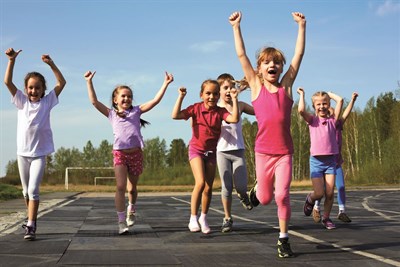 group of children running on the treadmill at the stadium